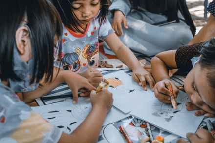 Preschool kids drawing in day care